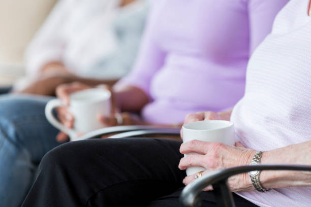 istock Unrecognizable senior adults sitting on porch drinking coffee 926365458