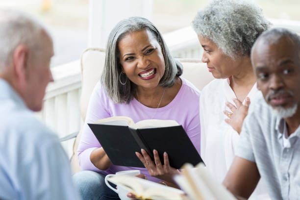 istock Active senior adults participating in a book club 926365472