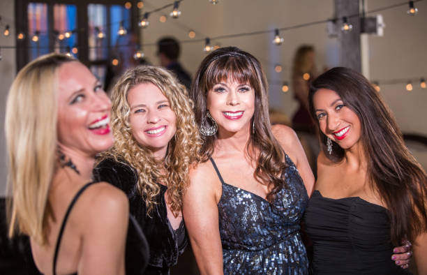 istock Four Women Smiling at a Party 926369102