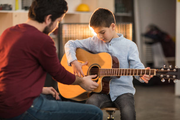istock Playing the guitar with my brother 926369964