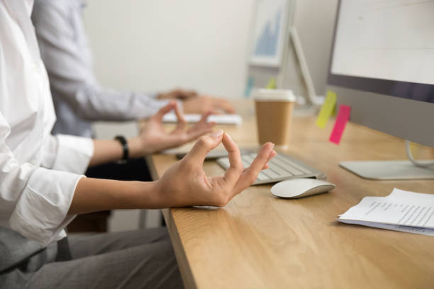 office yoga for relaxation concept, female hands in mudra, closeup - yoga business women indoors imagens e fotografias de stock