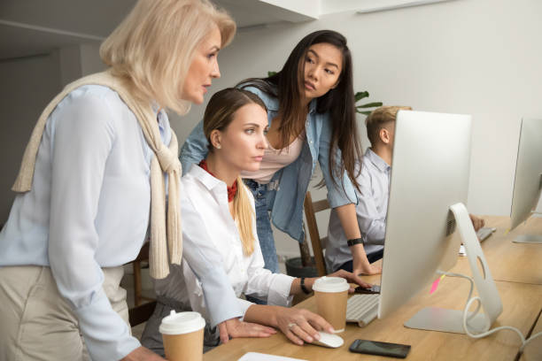 istock Serious focused multiracial female colleagues working together on online project 926375610