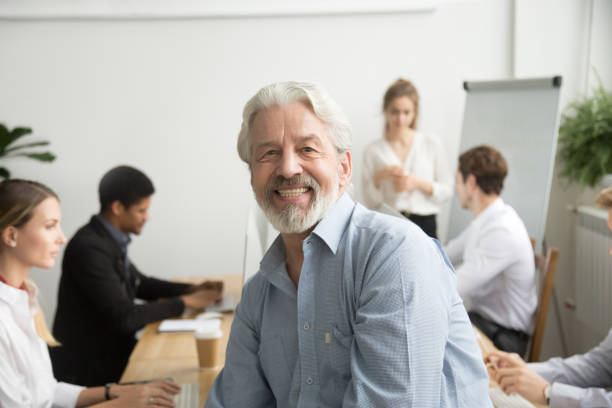 istock Smiling male senior team leader, mentor boss looking at camera 926375664