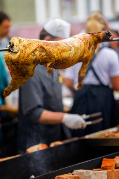 istock Carcass of sheep, suckling pig on rotating spit with fire on spit, bbq 926375874