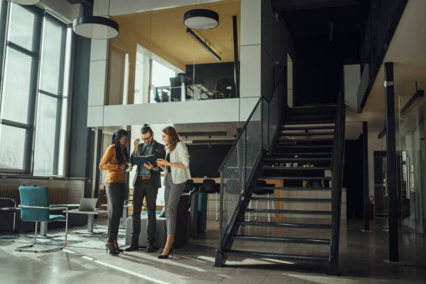 istock Colleagues looking over business plan in a lobby 926376072