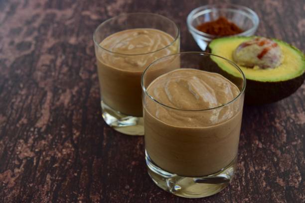 istock Chocolate avocado smoothie on dark wood background 926376514