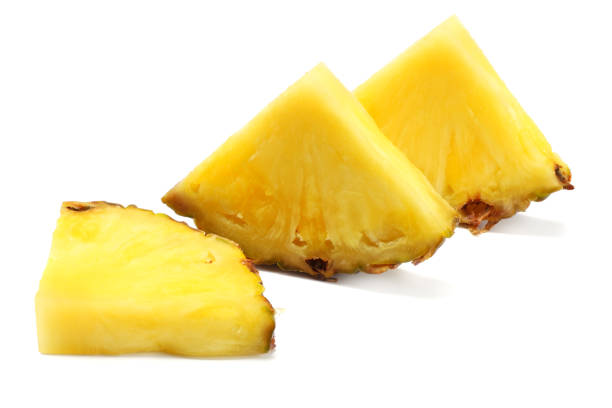 istock healthy background. pineapple slices isolated on white background 926376742