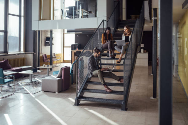 istock Group of three colleagues working in modern office 926376762