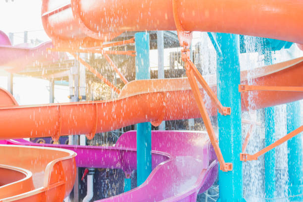 Yellow winding waterslide on the blue sky background