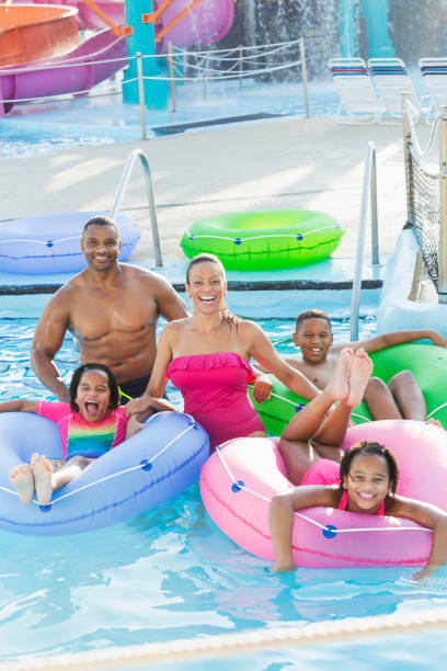 istock Family having fun at water park lazy river 926390234