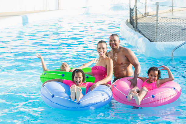 istock Family having fun at water park lazy river 926390366