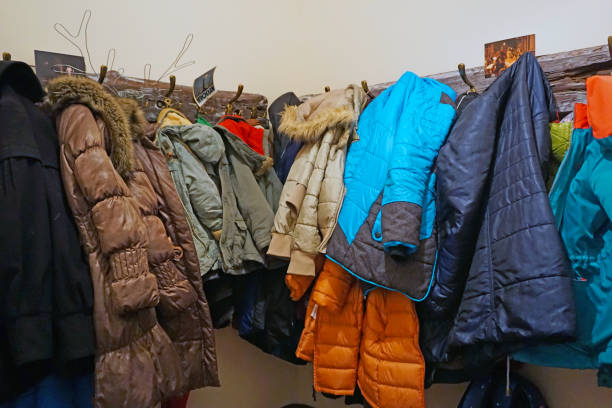 istock Outer clothing on hangers in the wardrobe 926393812