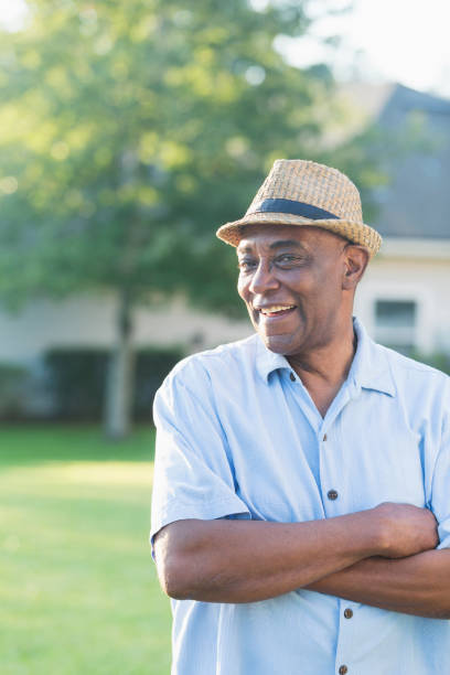 istock Senior African-American man standing in front yard 926396968