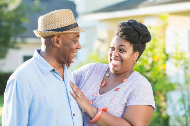 istock Senior man in front yard with adult daughter 926397016