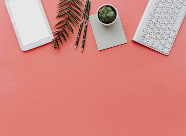 istock Minimal work space :keyboard, tablet and plants over pastel background. Top view , flat lay 926398610