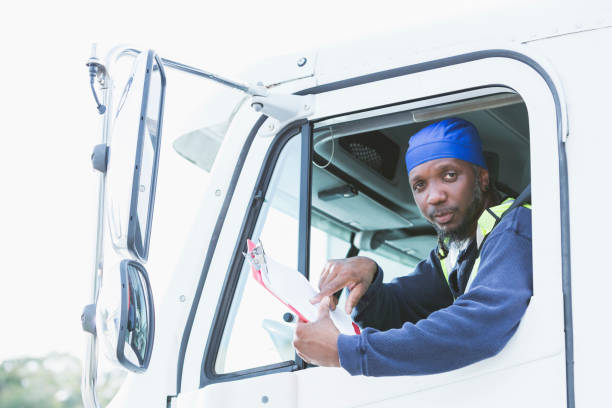 istock Mature black man driving semi-truck 926398686