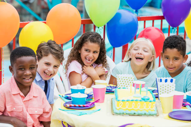 istock Multi-ethnic children at birthday party, laughing 926404058