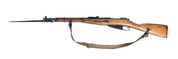 vintage military rifle with bayonet in its open position, isolated