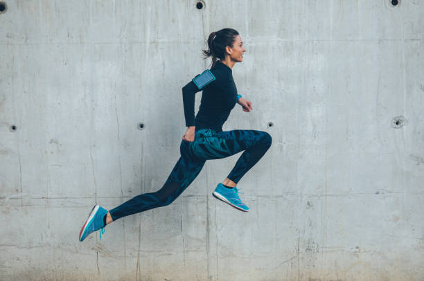 istock Woman jumping outdoors 926411074