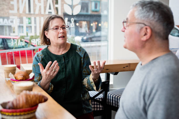 istock Senior couple having breakfast in a local coffee shop. 926412504