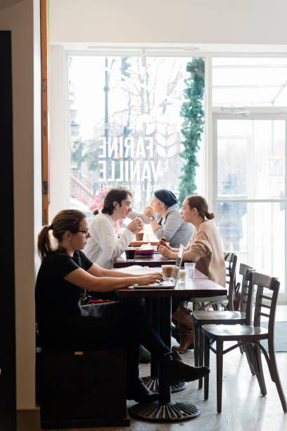 istock People spending leisure time in a local coffee shop. 926415542