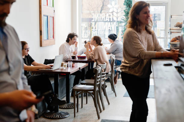 istock People spending leisure time in a local coffee shop. 926415650