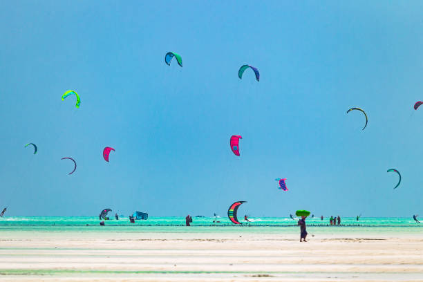 Kiteboarders in Paje. Zanzibar, Tanzania. stock photo