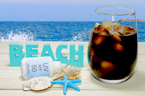 istock Synthesis of ice coffee and ocean background 926420306
