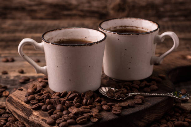 istock coffee cup with roasted  beans on wooden background 926421520