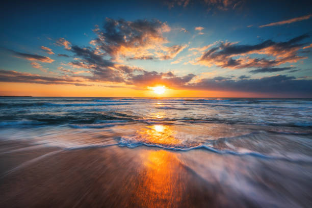 istock Sunrise over the sea and beautiful cloudscape 926424622
