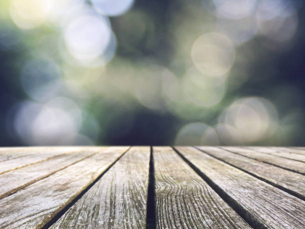 istock Rustic Wood Picnic Table Top Over Cool Nature Blurred Bokeh Background 926425144