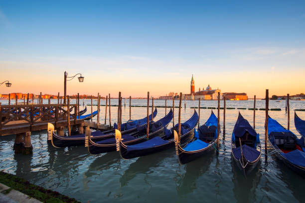 istock Venice with famous gondolas at sunrise 926427536