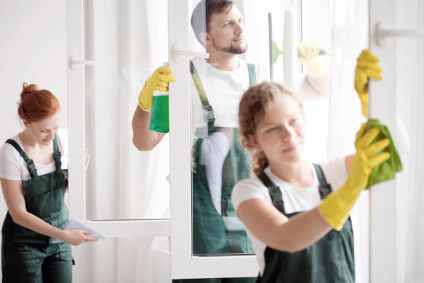 istock Skilled cleaning team washing windows 926436662