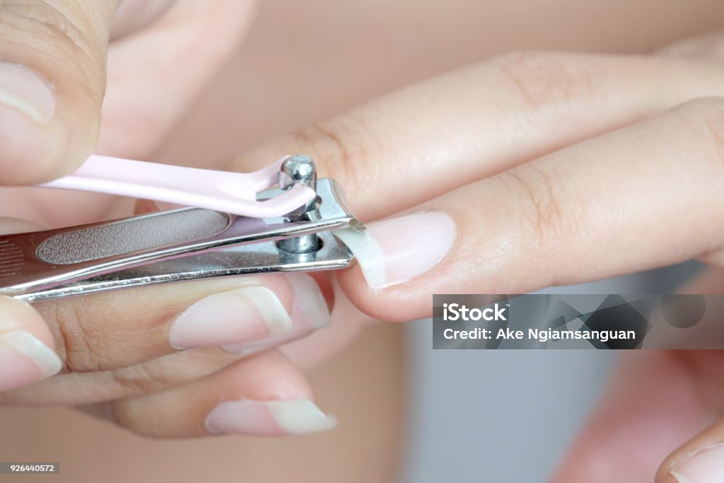 Fingernail Beauty Care Clipper Closeup Cut Cutter Equipment Female Finger Girl Hand Holding Hygiene Hygienic Isolated Manicure Metal Nail Personal Skin Tool Trim White Woman Marco Salon Treatment Clean Spa Beautician File Fingernail Beauty Care Clipper Closeup Cut Cutter Equipment Female Finger Girl Hand Holding Hygiene Hygienic Isolated Manicure Metal Nail Personal Skin Tool Trim White Woman Marco Salon Treatment Clean Spa Beautician File