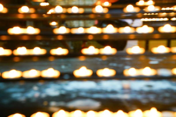 istock Zoom blur effect prayer candles in rows in church 926450566