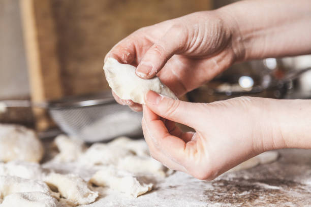 istock hands of woman make dumpling over granite table 926468468