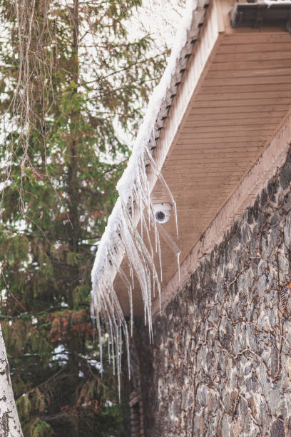 istock Icicles of original form hang on roof 926470970