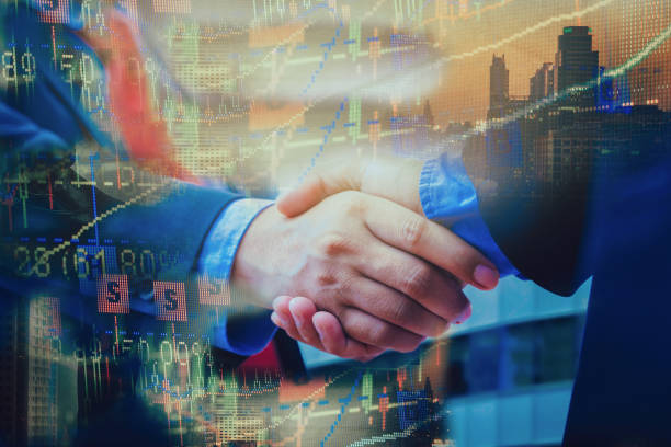 istock closeup business handshake on building background 926472020
