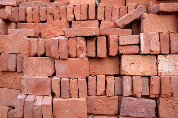 istock Pile of orange bricks for a wall or construction making a great background. 926472800