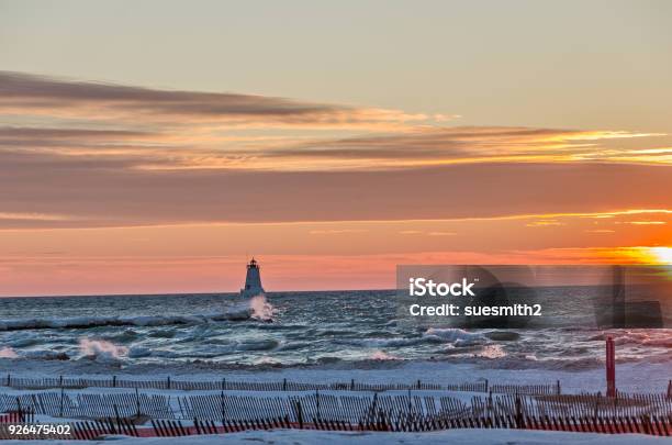Lighthouse With A Diagonal Sunset In The Background Stock Photo - Download Image Now