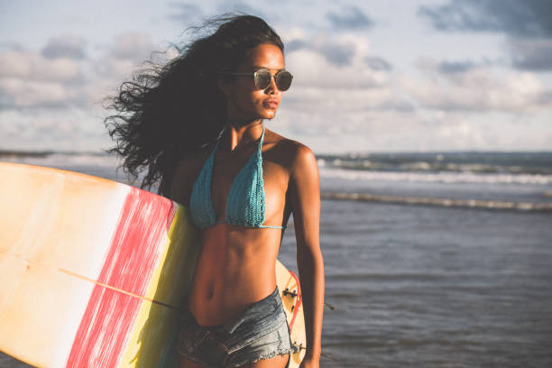 istock Young surfer woman 926482668