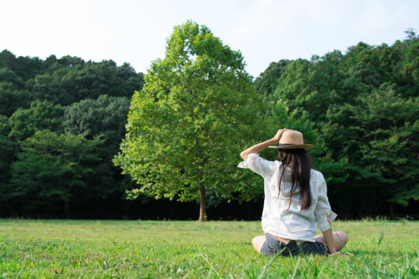istock Woman relaxing in a lawn 926486392