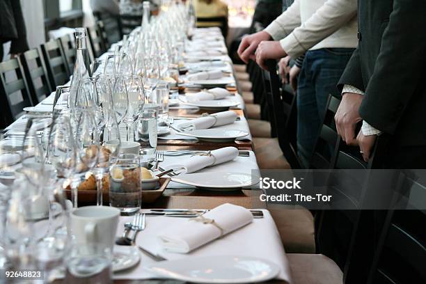 Guests In Front Of Table Set For Dinner Stock Photo - Download Image Now - Banquet, Table, Luxury