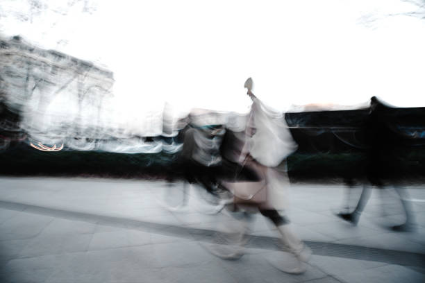 Blurred background. Pedestrians hurrying to transport