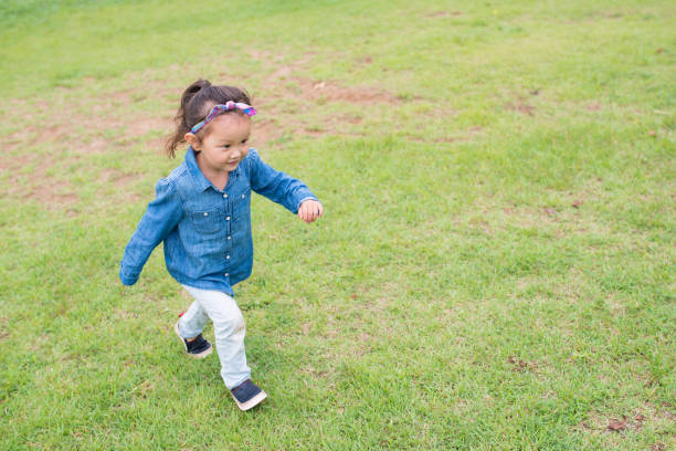 istock Little girls playing on the lawn 926494148