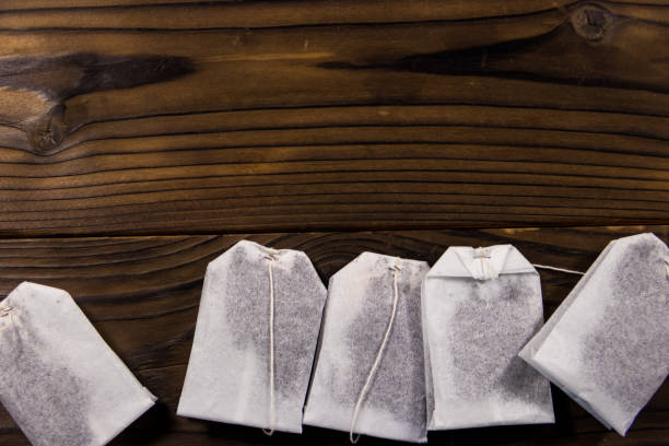 istock Tea bags on wooden table. Top view 926497948
