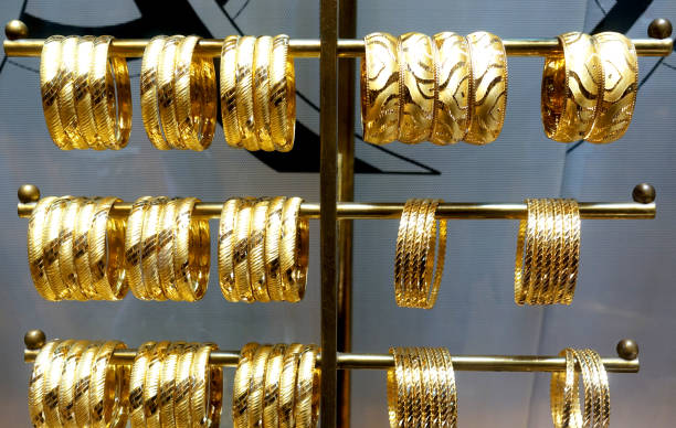 istock Gold rings hang on holders 926498322