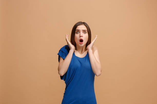 istock Beautiful woman looking suprised isolated on pastel 926501982