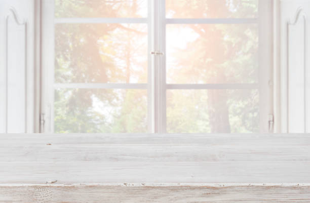 istock Empty wooden table top on blurred background of vintage window 926502174