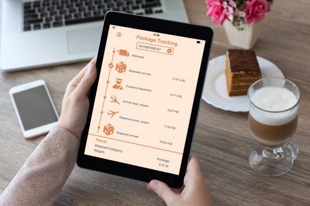 istock woman hands holding tablet computer with app tracking delivery package 926502328
